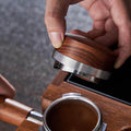 KNODOS 58mm espresso precision tool showing the adjustable distributor base in a professional black finish.