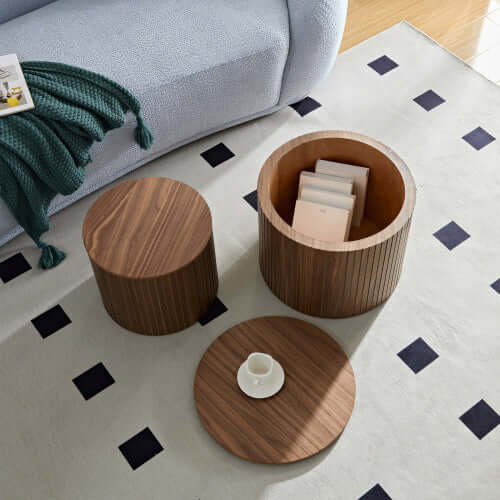 Space-saving vertical storage feature showing one round table tucked neatly under the other.