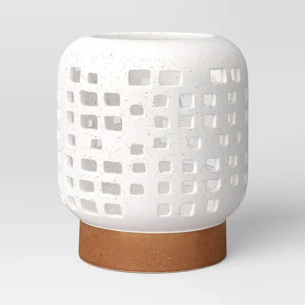 7" Modern Ceramic Pillar Candle Lantern featuring geometric cut-outs and speckled finish, perfect for candle display.