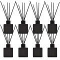  8-pack matte black square reed diffuser bottles with black fragrance sticks and stoppers for home aromatherapy.