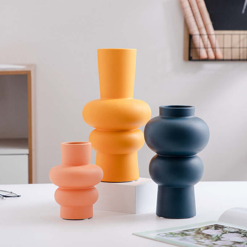 Nordic Minimalist Ceramic Vase collection in pastel colors on a table, modern geometric flower pots for home decor.