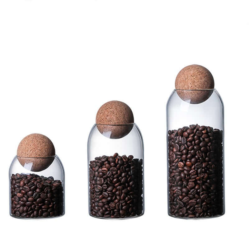 Set of 3 minimalist glass food storage jars with natural bamboo lids on white background