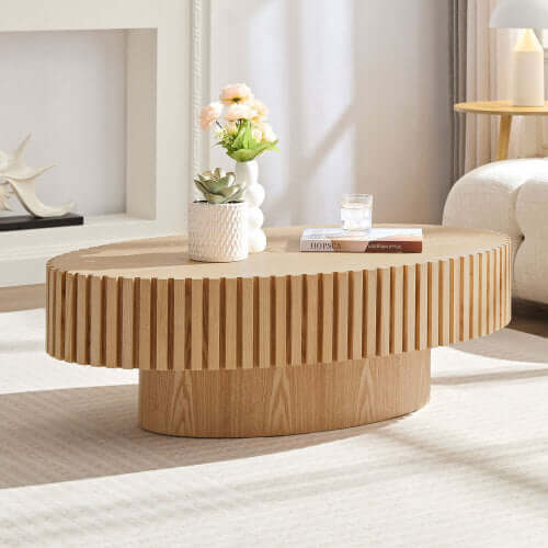 Minimalist living room featuring the natural ash drum coffee table as a central decor piece.