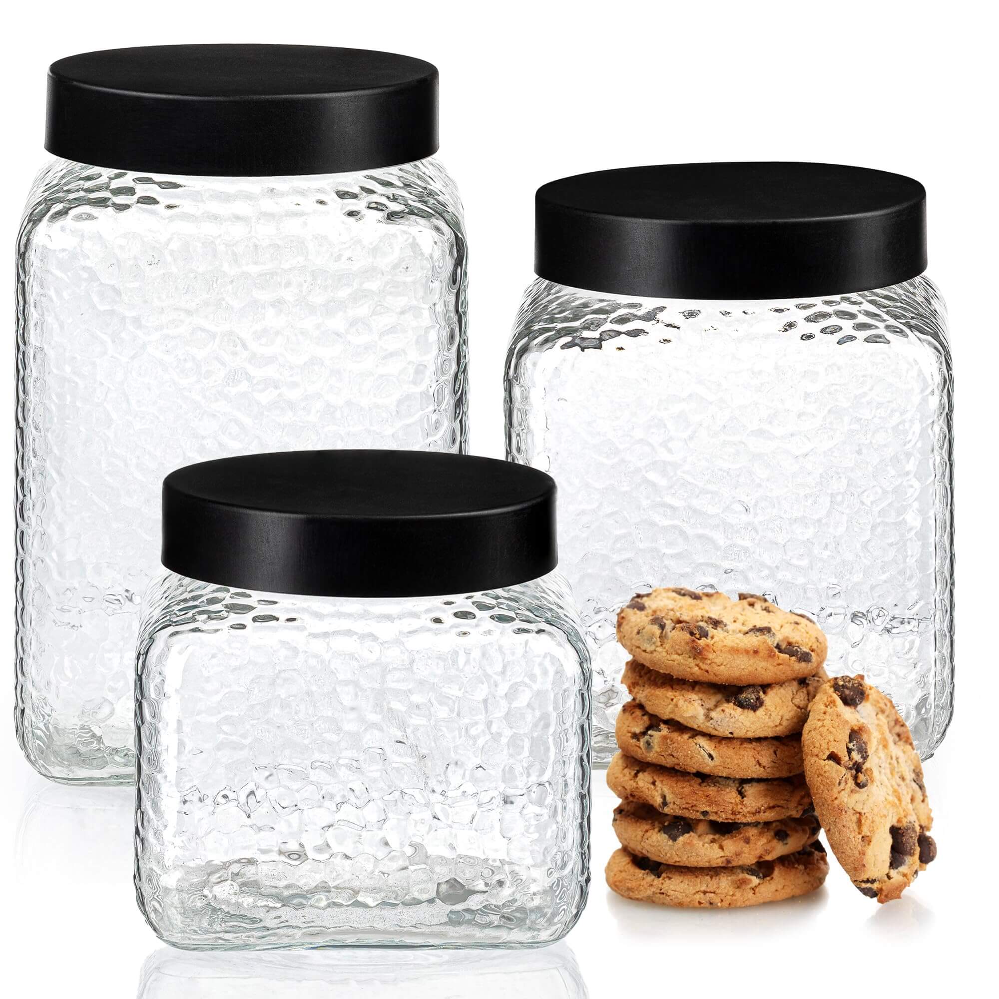 Set of 3 retro glass canisters with vertical ribbing and black metal lids