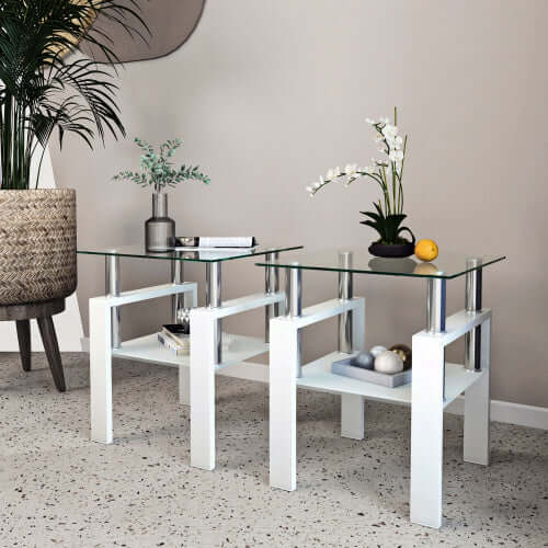 Modern living room interior featuring the set of 2 glass tea tables styled with minimalist decor on a designer rug.