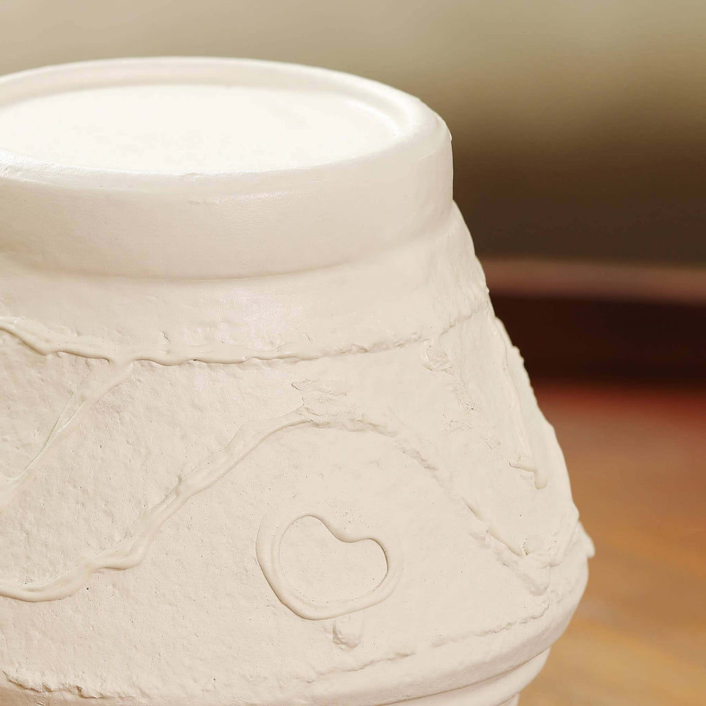 Detailed organic textured pattern on handmade terracotta candle stand