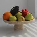 Modern travertine marble centerpiece bowl on a minimalist dining table