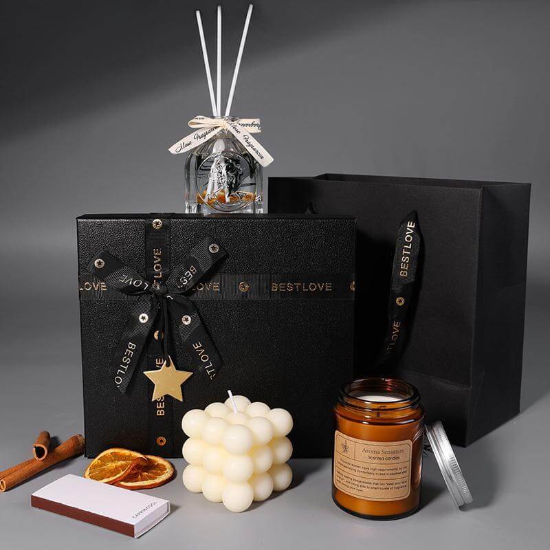 Luxury aromatherapy candle and oil gift set in elegant black box with decorative elements, perfect for weddings and birthdays.