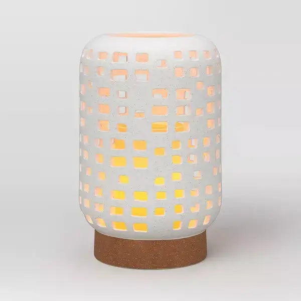 7 inch modern ceramic candle lantern with geometric cut-outs and warm glow, perfect for elegant home decor.