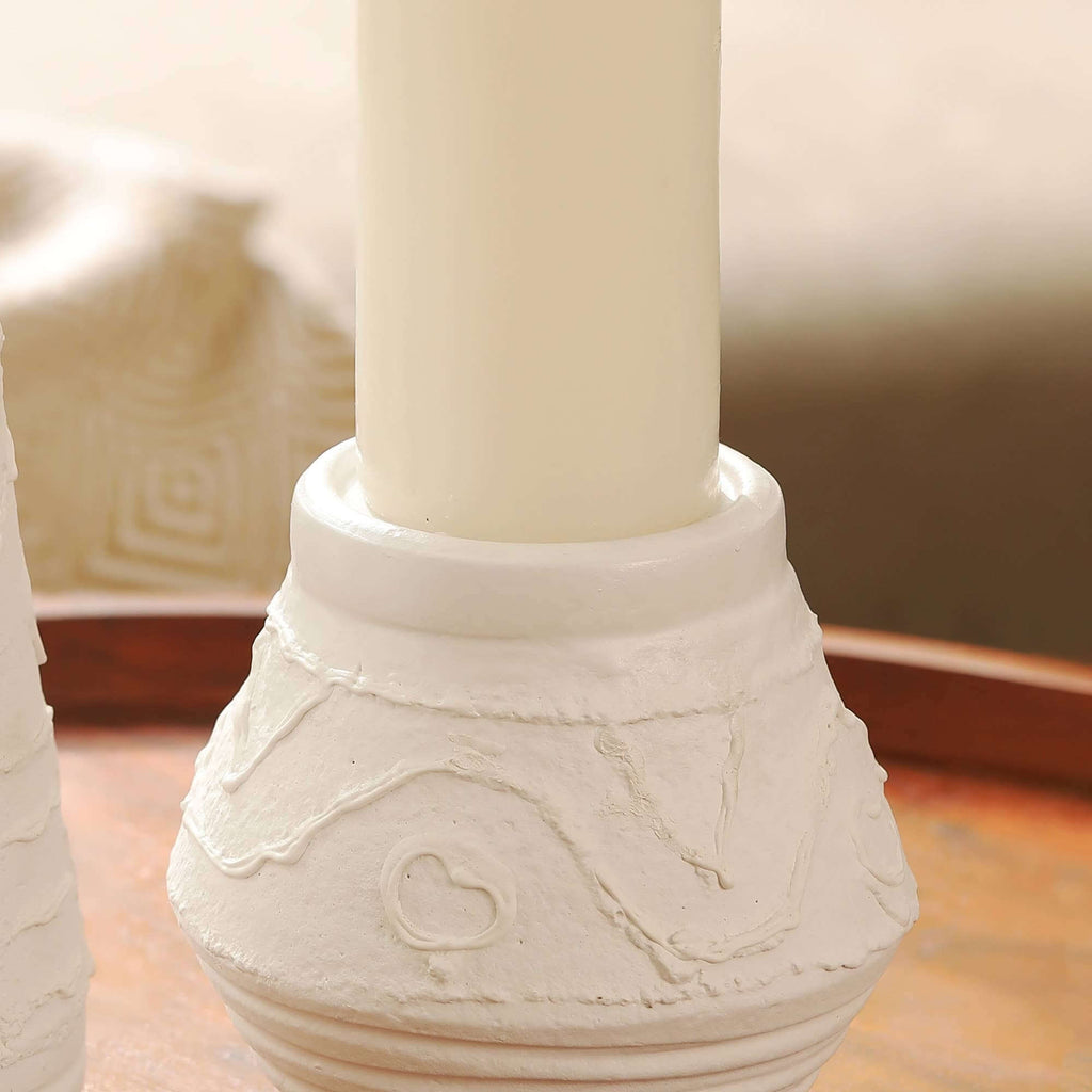 Rustic white clay candle holder for ambient lighting in a living room