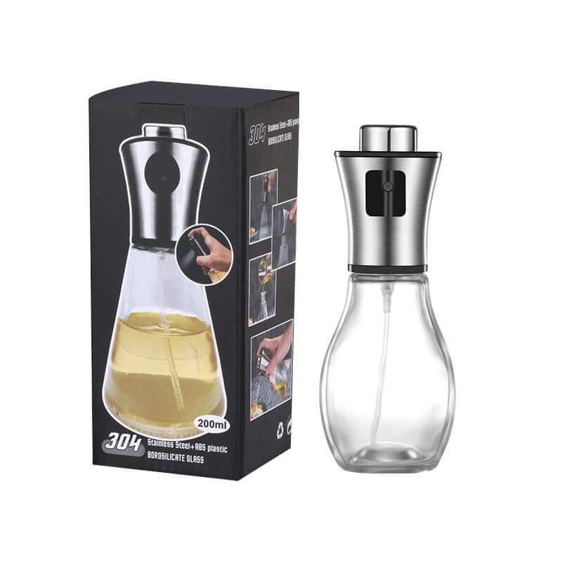 Minimalist glass oil and vinegar dispenser bottle with stainless steel pourer on a kitchen counter