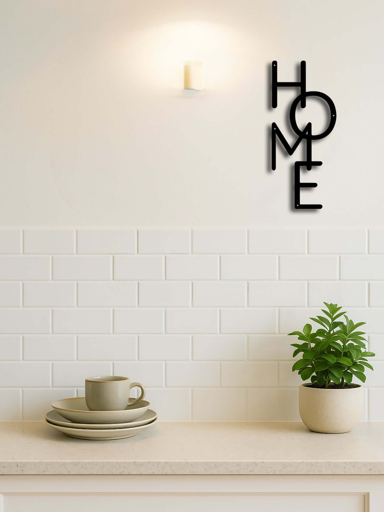 Minimalist metal "HOME" wall art sign on kitchen wall with dishes and plant, perfect decor for modern living spaces.