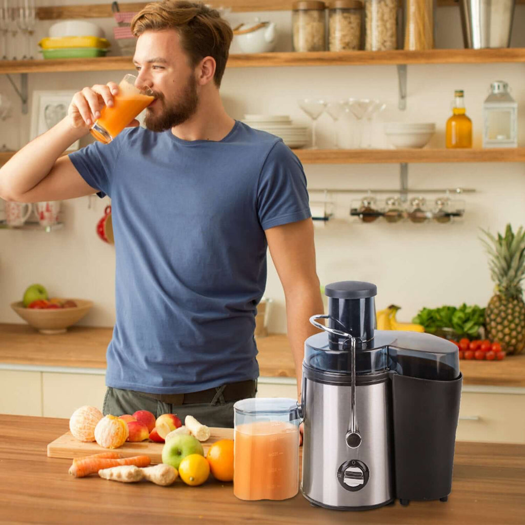 Man enjoying fresh juice made with a powerful 1000W centrifugal juicer surrounded by fruits and vegetables.