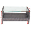 35" rectangular outdoor coffee table with tempered glass top and weather-resistant brown PE rattan design.