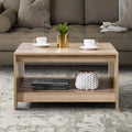 Modern farmhouse living room featuring a black oak square coffee table styled with minimal decor.