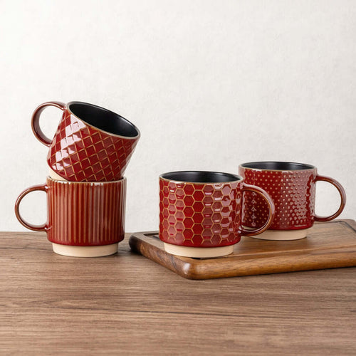 Enjoying a fresh cup of coffee in a Rythmic Red GBHOME ceramic mug at a clean, modern coffee station.