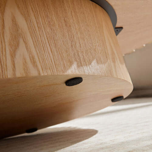 Close-up of the natural ash wood grain and smooth finish on the handmade Sip & Sort coffee table.