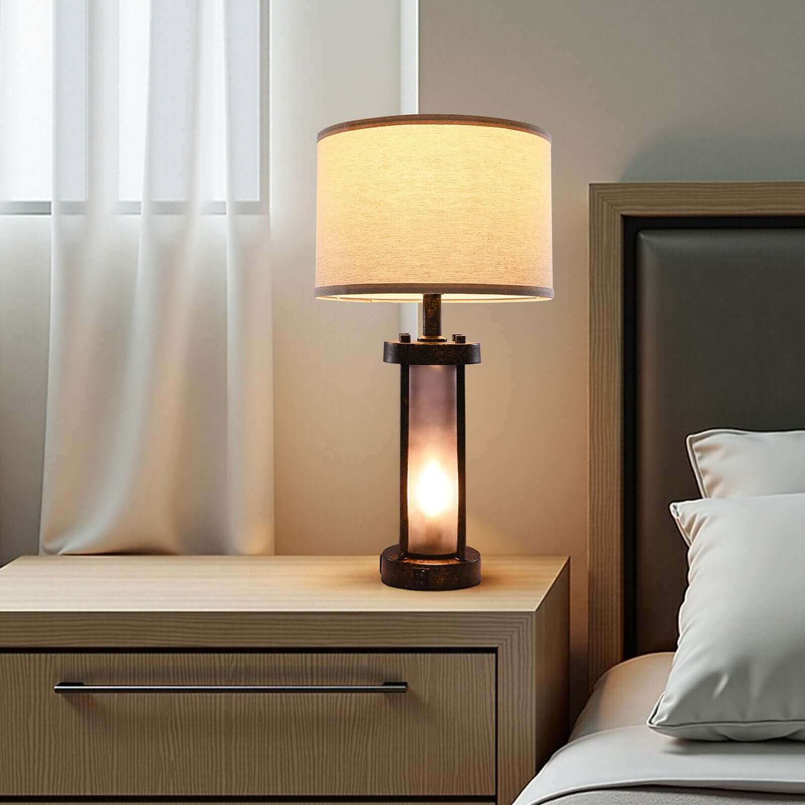 Pair of bedside nightstand lamps providing warm light in a farmhouse bedroom